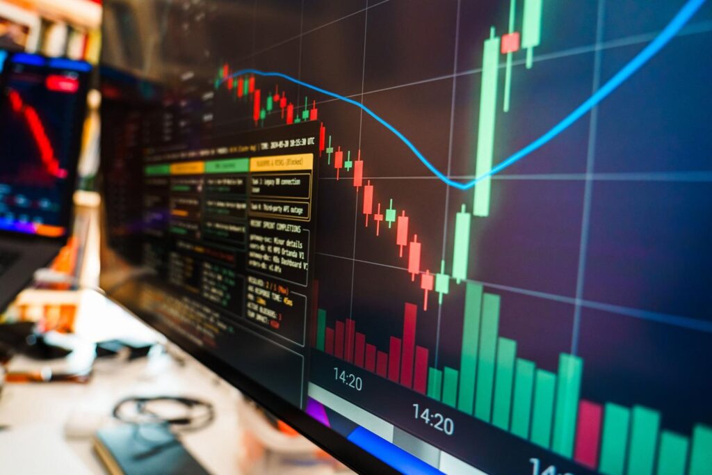 Monitor financiero mostrando gráficos de datos en tiempo real, representando el seguimiento de costes y presupuestos de IA.
