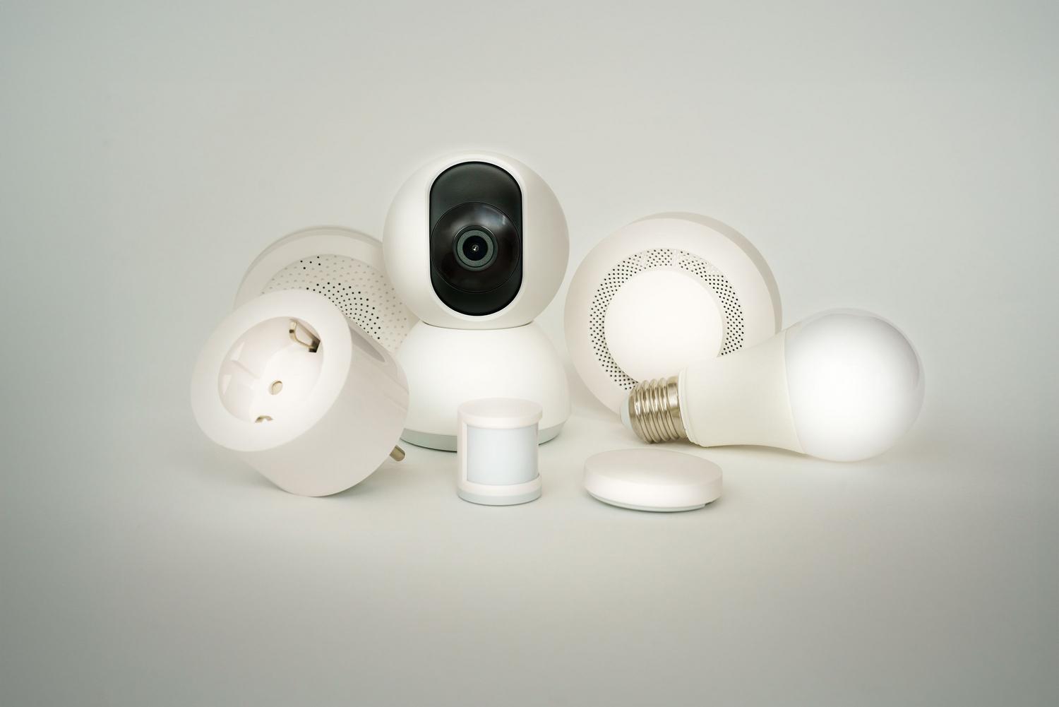 Collection of smart home IoT devices like bulbs and cameras, representing the devices that should be isolated.