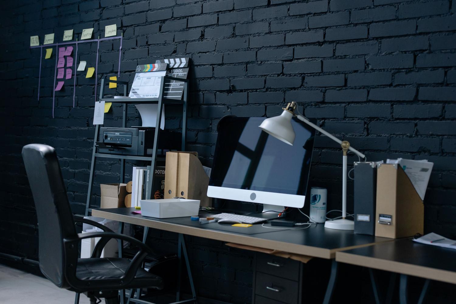 A modern and organized home office setup with a desktop computer, providing a professional environment for tech management.