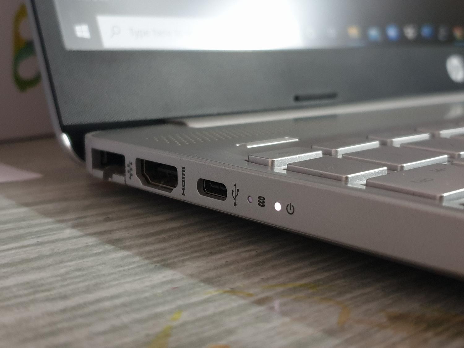 Detailed view of the ports on a laptop, showing the USB connection points.