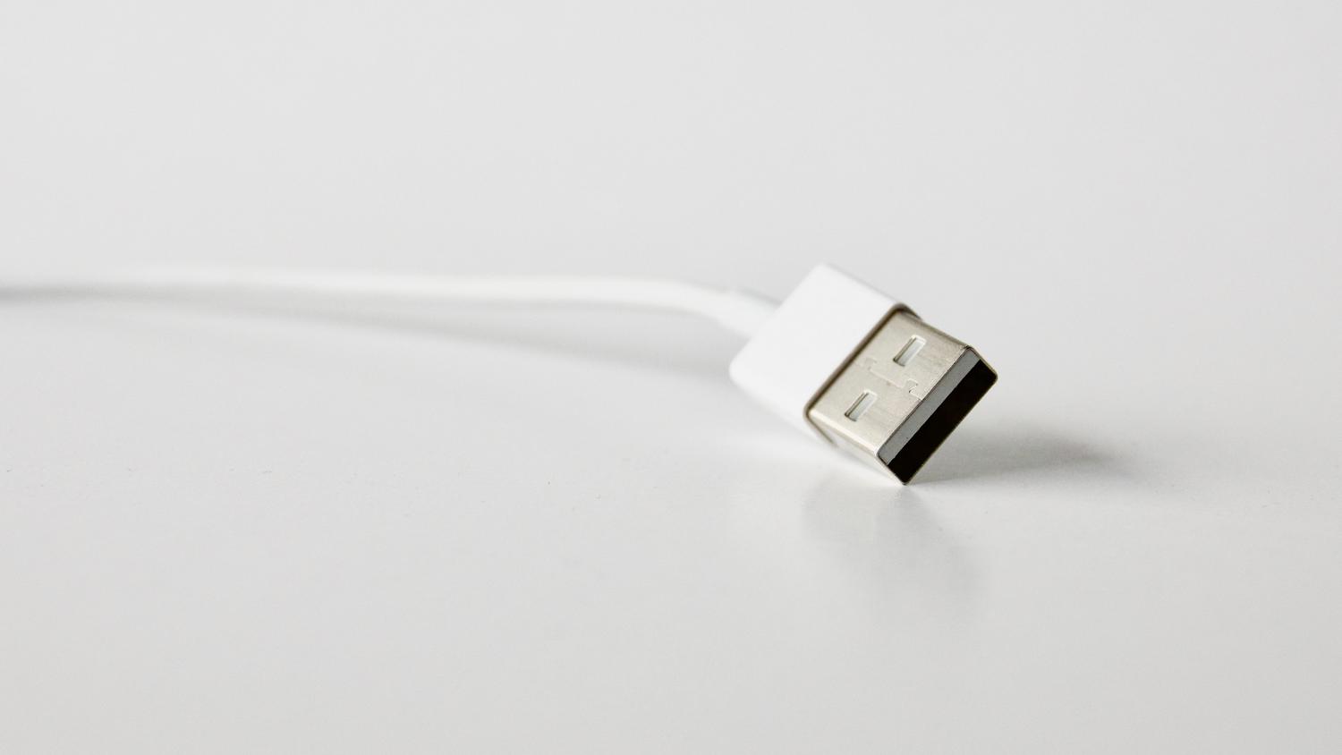 Detail of a white USB cable, ideal for illustrating the cable condition check.