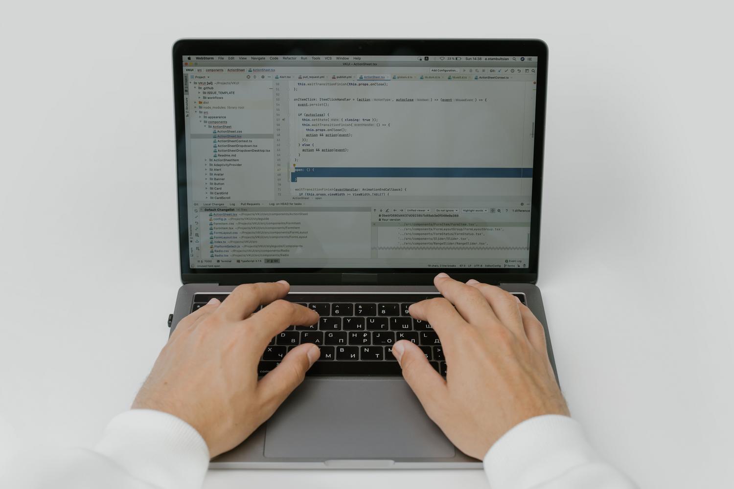 Person working on a laptop computer, illustrating the process of troubleshooting technical problems.